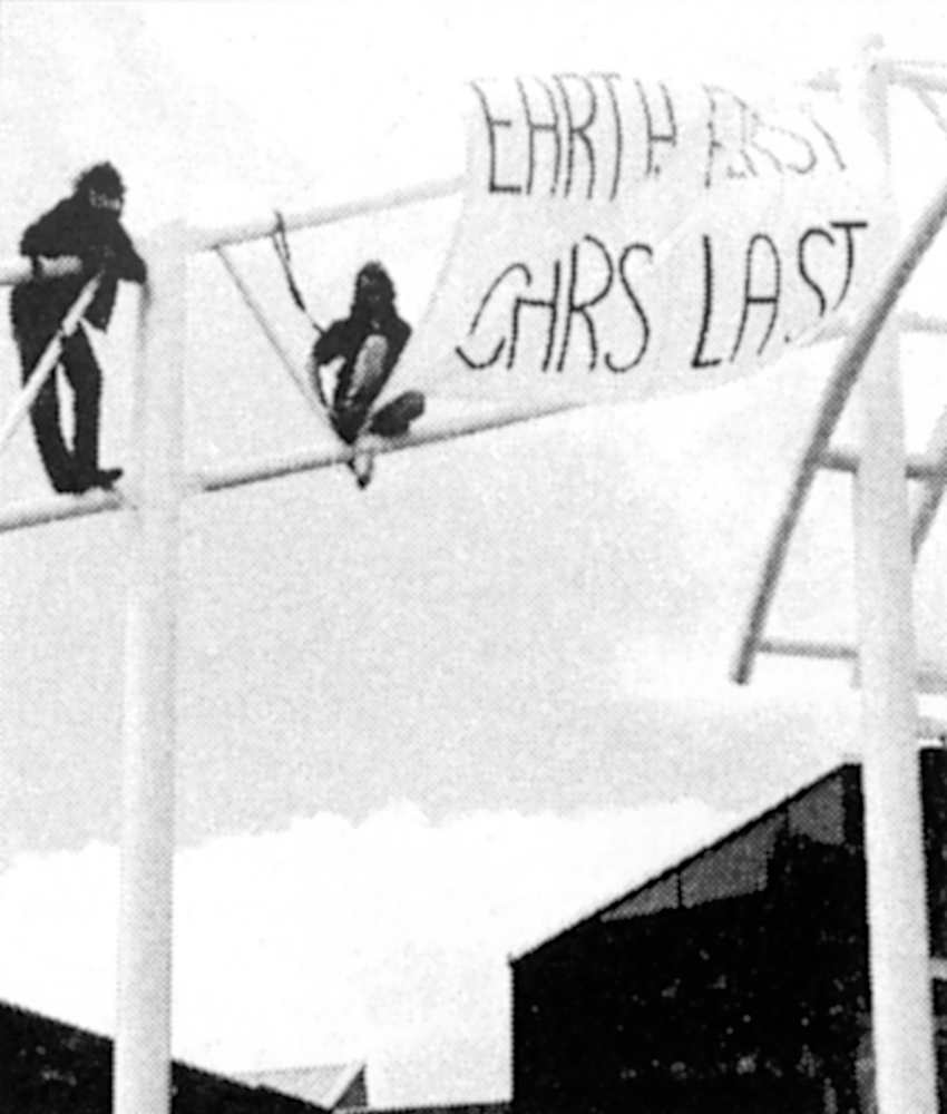 Cambridge EF! unfurl 'Earth First - Cars Last' banner at Rover dealership on Climate Action Day 1995